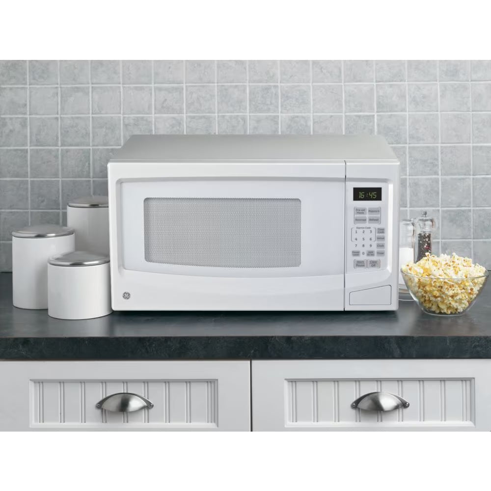 GE 1.1 cu. ft. Countertop Microwave Oven in White - PuriLite
